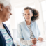 Working for an agency, like this caregiver who’s with a client, can be a choice that leads to a good job.