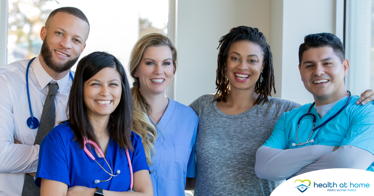 A team of healthcare professionals smiles, representing the many career paths that professional caregiving can lead to.