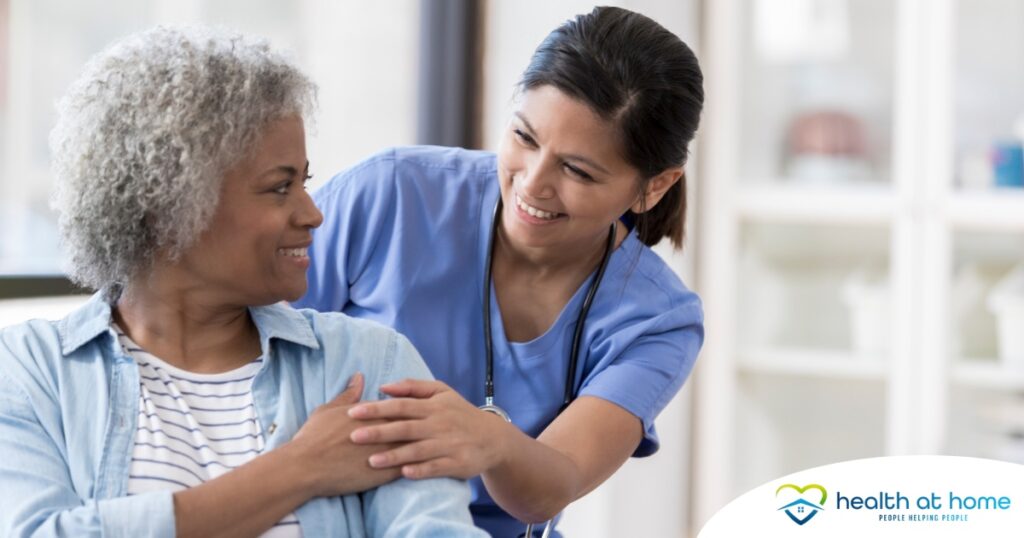 A nurse warmly takes care of a patient, representing the quality care and hard work that National Nurses Month highlights.