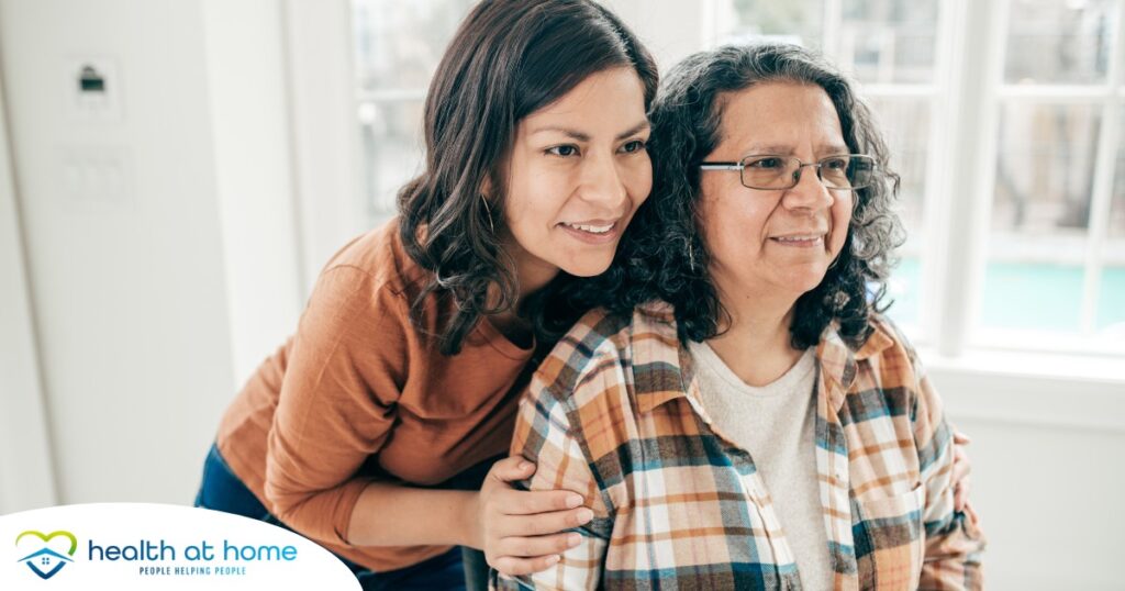 A woman hugs her older mother, representing compassionate senior care