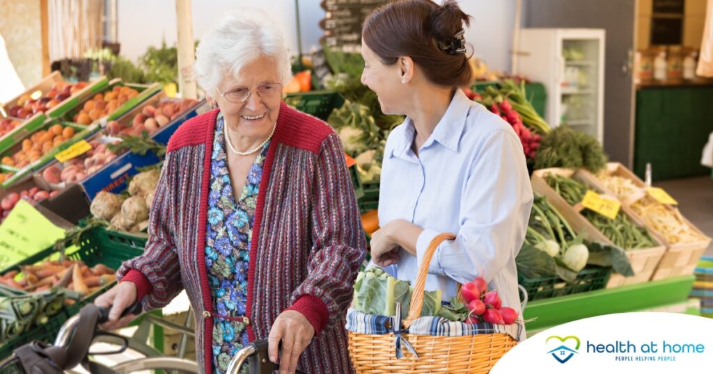 A caregiver shops for groceries with an older adult, representing shopping for a diabetes-friendly diet.