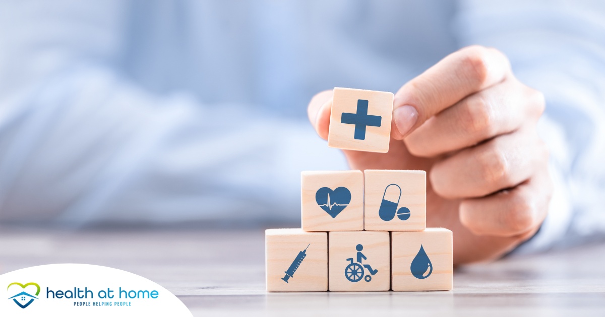 A stack of block with different health related icons represents health insurance which can help with home health care.