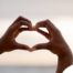 Alt Text: 2 hands making a heart represent self-care, a vital concept to appreciate as a caregiver.