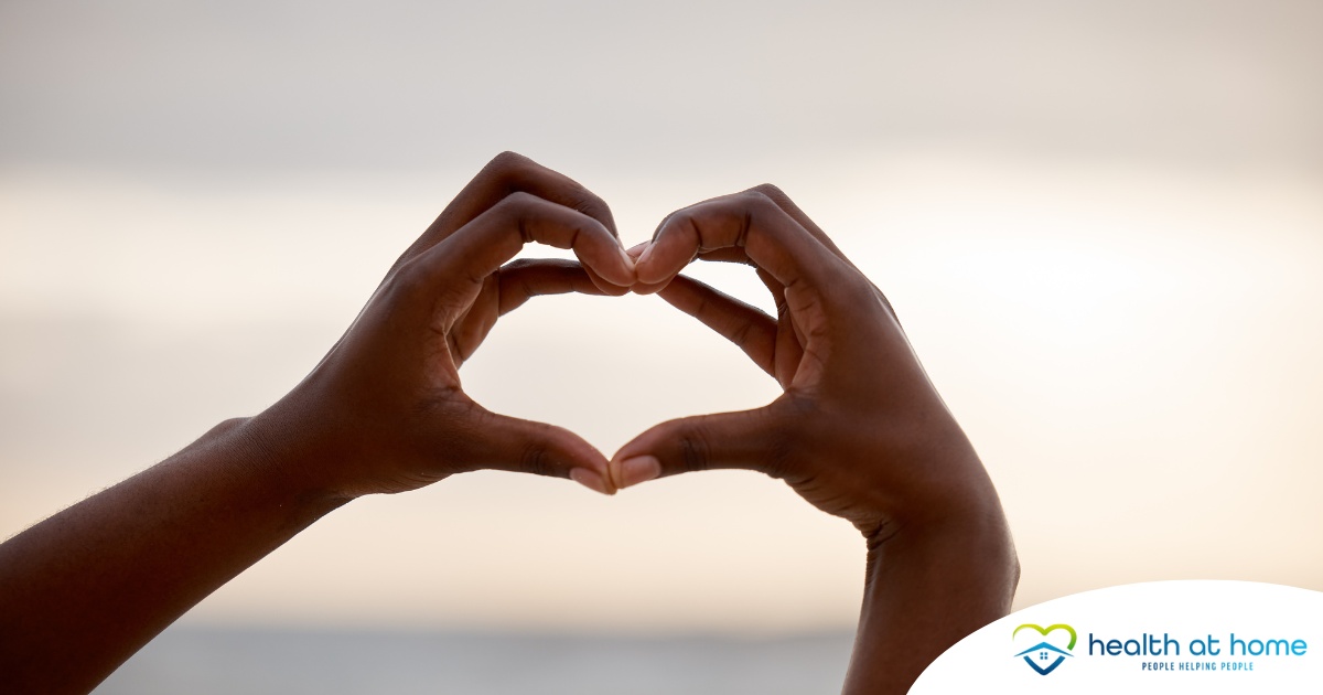 Alt Text: 2 hands making a heart represent self-care, a vital concept to appreciate as a caregiver.