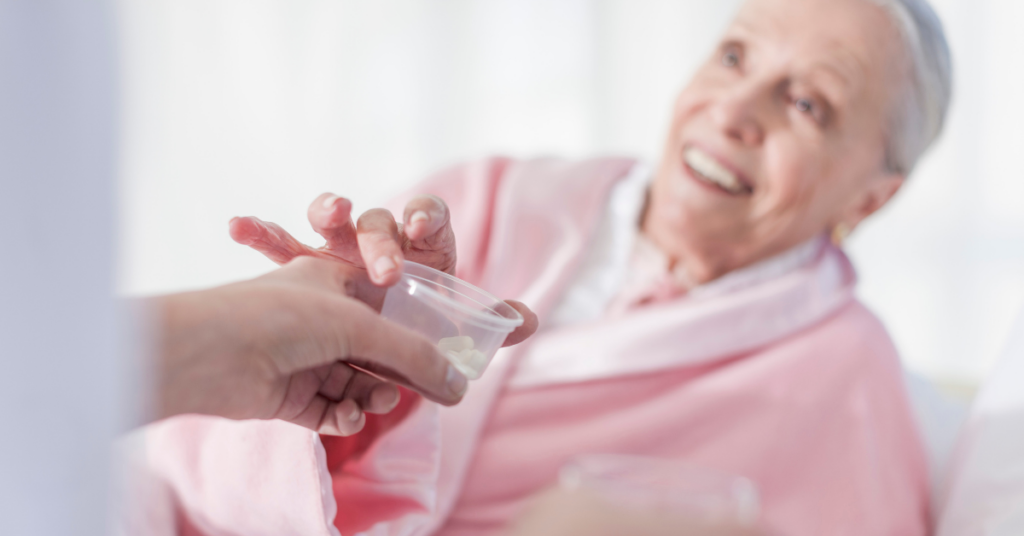 woman receiving medication from in home caregiver in florida