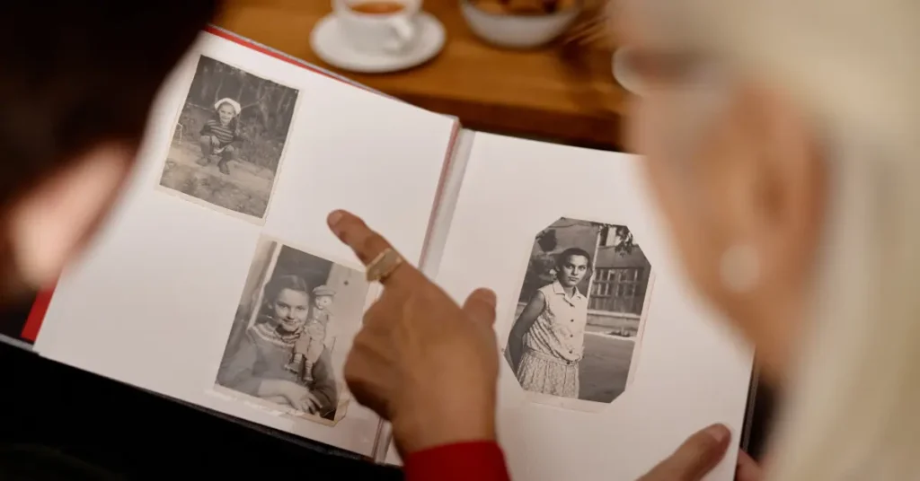 Elderly couple looking at old photos, discussing companion care in Florida.