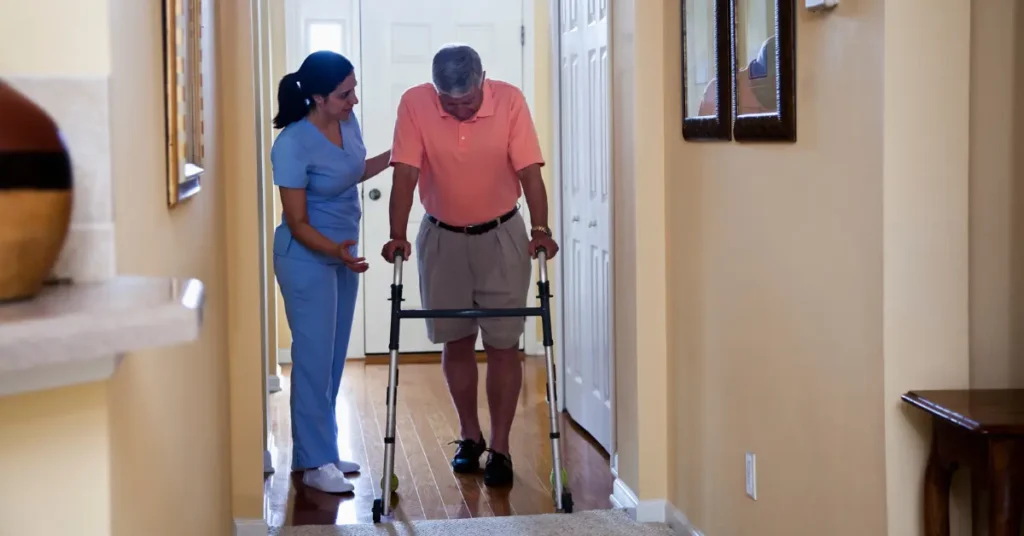 Nurse assisting elderly man with walker for home health care in Florida.
