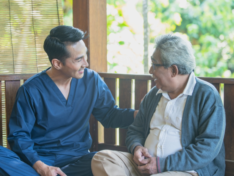 Caregiver assisting senior with in-home care services in Florida.