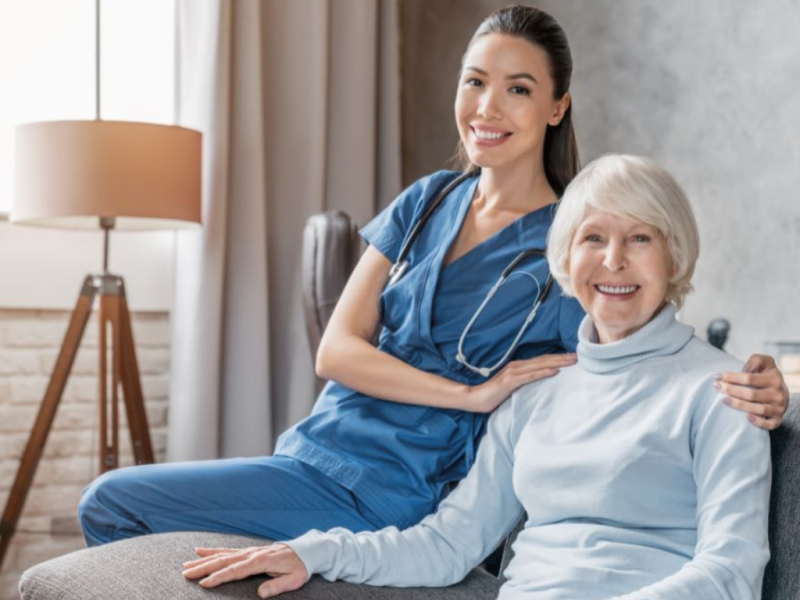 Caring in-home senior care services FL: Nurse with smiling elderly woman